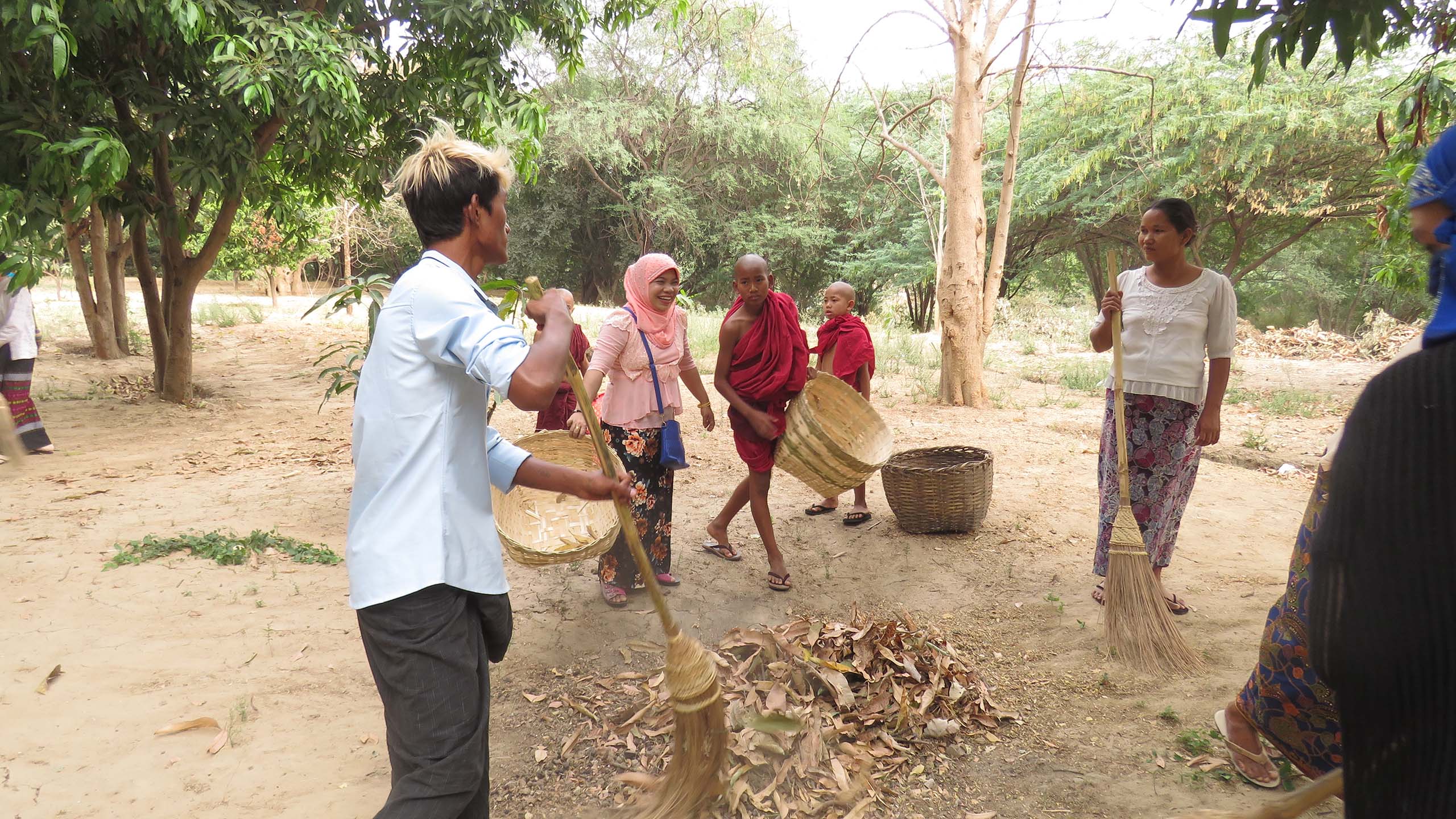 Interfaith Youth Network, Women of Faith Network and the Buddhist Novice Monk cleaning the compound together